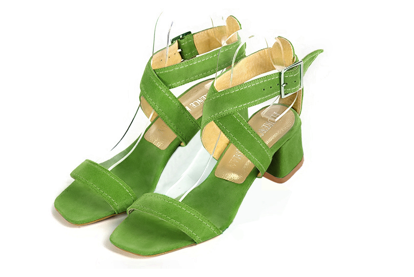 Grass green elegant sandals with cross straps across the instep, fully open. Square toe. Low flare heels.